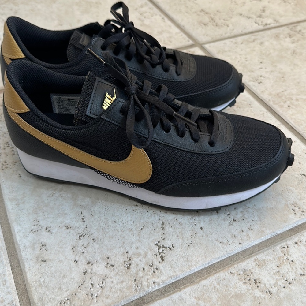 Black/Gold Nike sneakers
